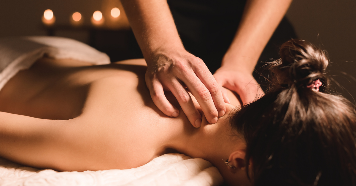 massage therapist giving a client a massage